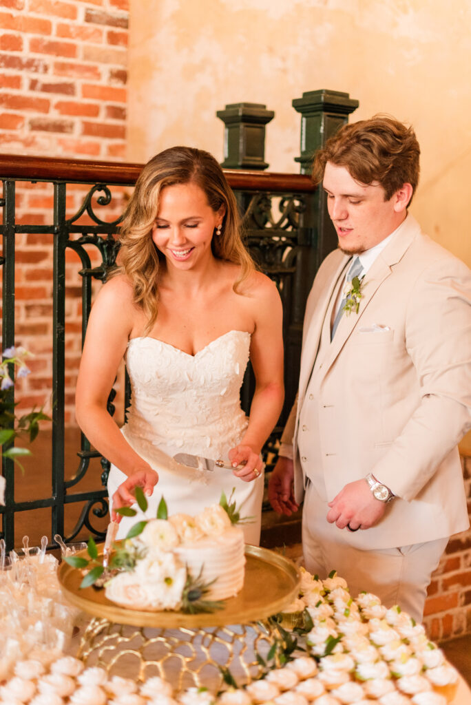 A bride and groom cutting the cake at the bleckley inn